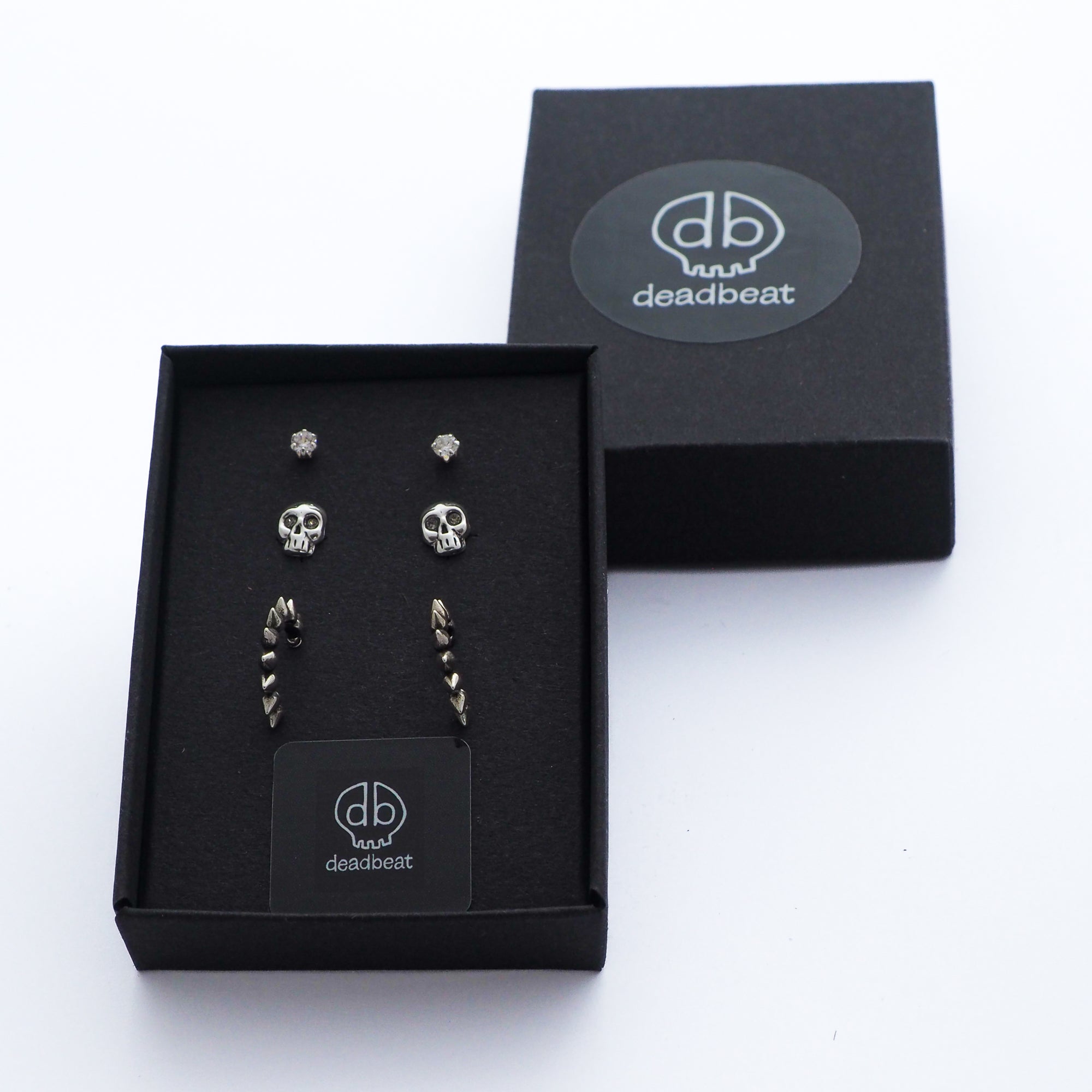 DEADBEAT Rock-Solid 925 Silver Clear CZ Ear Stud, Oxidised Black Diamond Crystal Skull Ear Stud & Oxidised Spiked Hoop Ear Stud Gift Pack