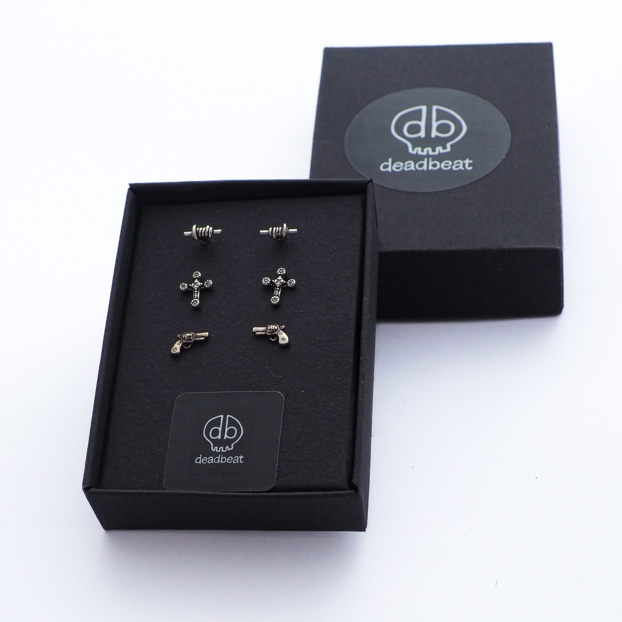 DEADBEAT Rock-Solid 925 Silver Oxidised Barbed Wire Ear Stud, Oxidised Clear Crystal Gothic Cross Ear Stud & Revolver Gun Ear Stud Gift Pack