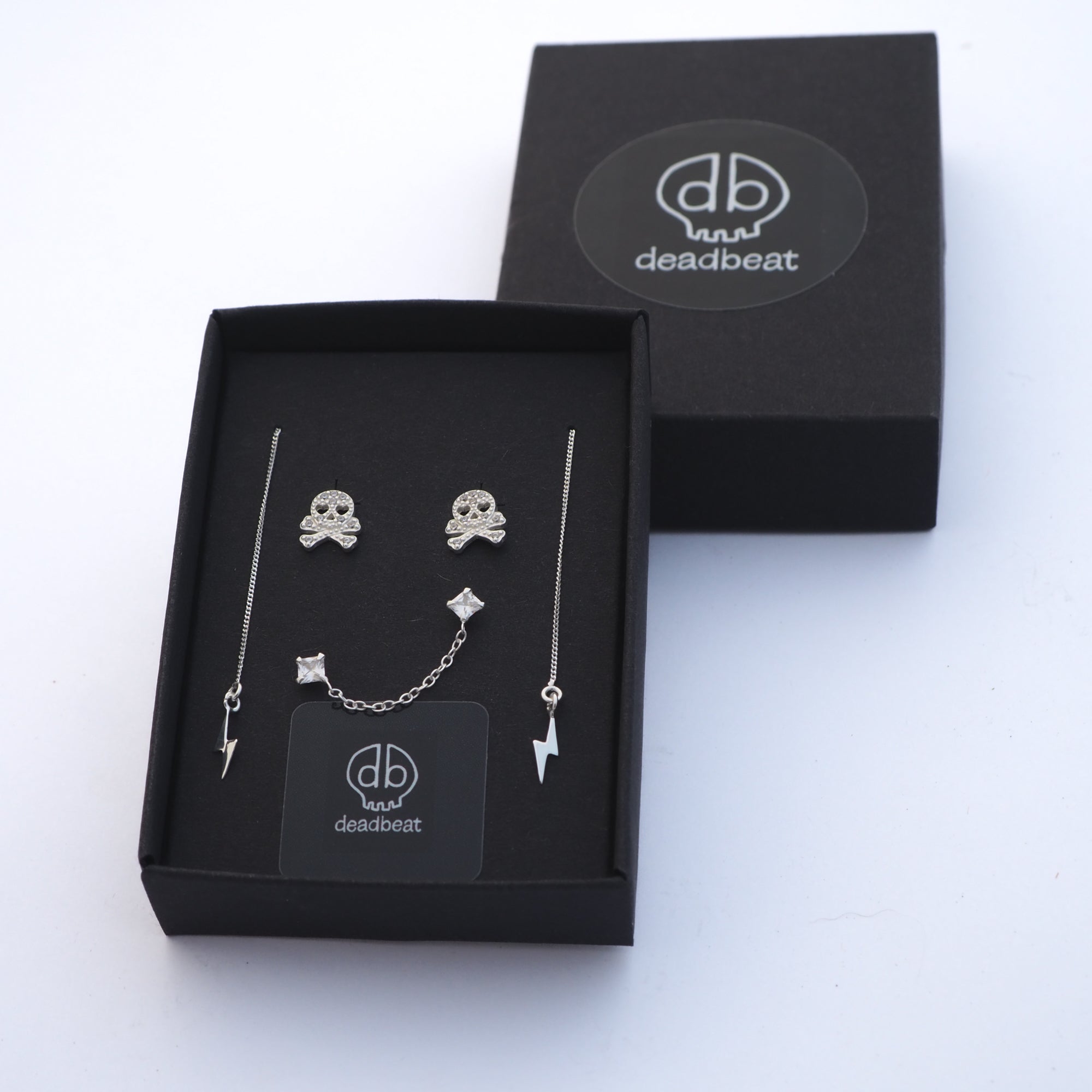 DEADBEAT Rock-Solid 925 Silver CZ Skull & Crossbones Ear Stud, Single CZ Double Ear Stud & Lightning Bolt Drop Ear Stud Gift Pack