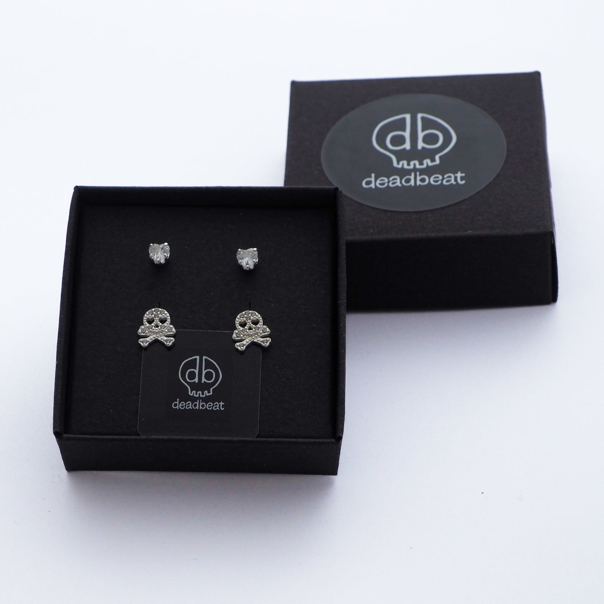 DEADBEAT Rock-Solid 925 Silver CZ Heart Ear Stud & CZ Skull & Crossbones Ear Stud Gift Pack