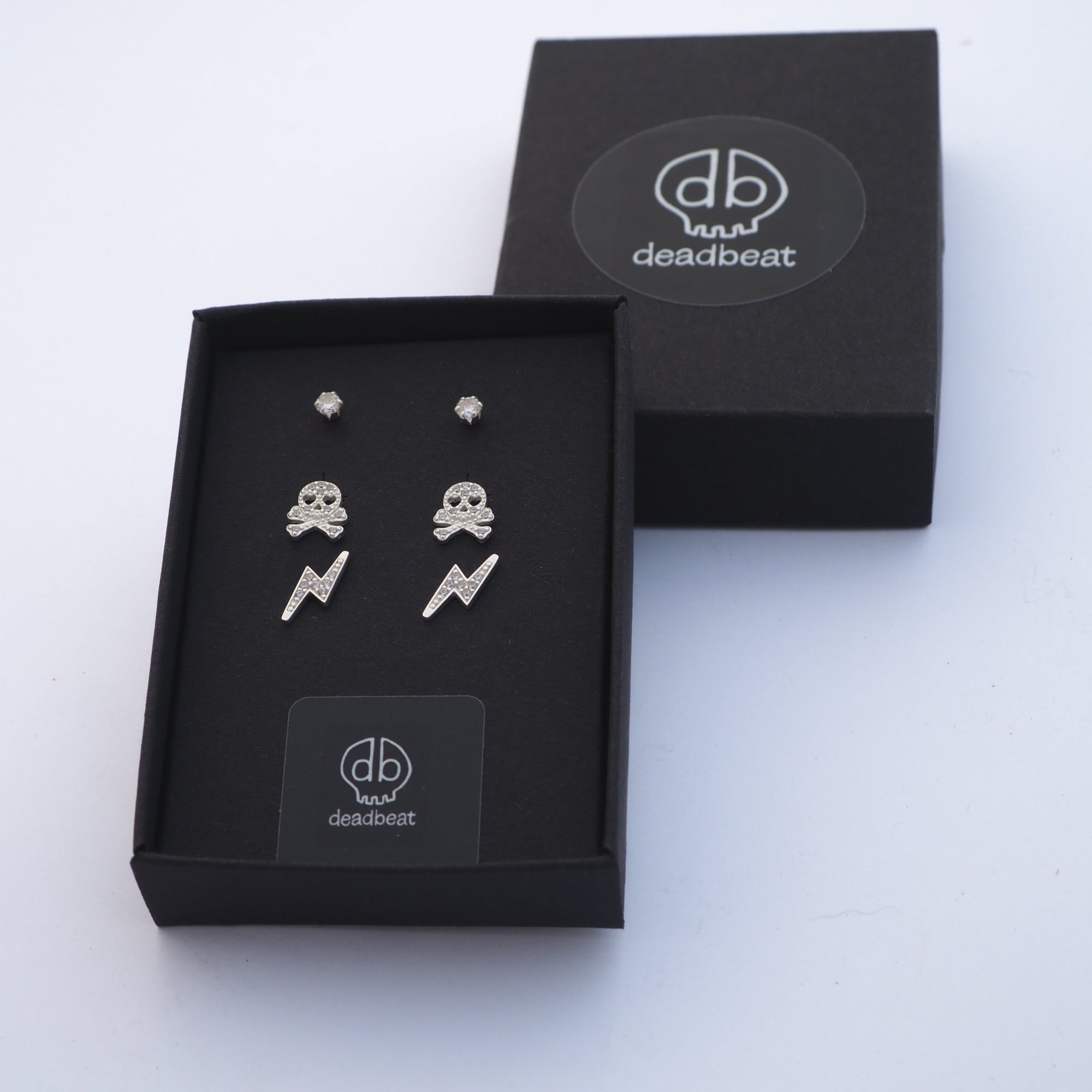 DEADBEAT Rock-Solid 925 Silver CZ Ear Stud, Skull & Crossbones Ear Stud & CZ Lightning Bolt Ear Stud Gift Pack
